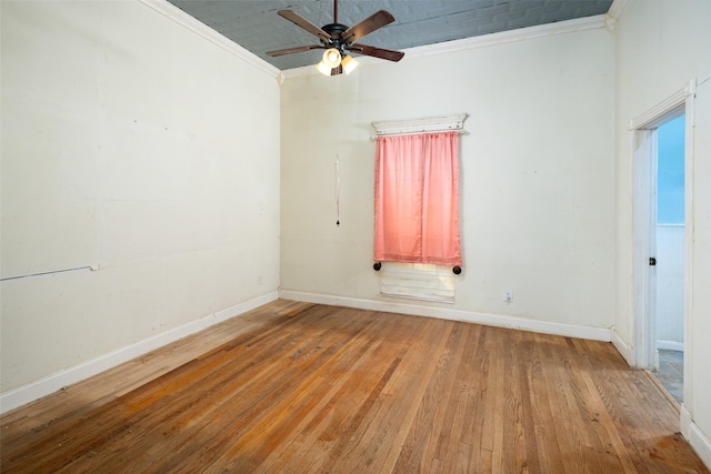 spare room with crown molding, ceiling fan, and light hardwood / wood-style floors