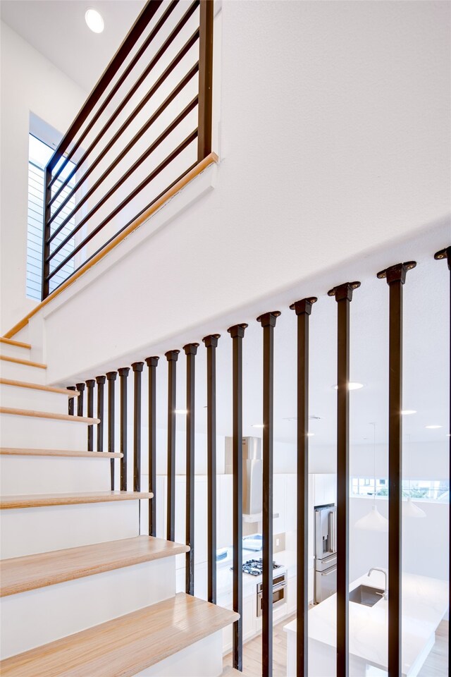 stairs with wood-type flooring