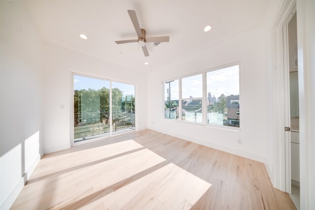 spare room with ceiling fan and light hardwood / wood-style flooring