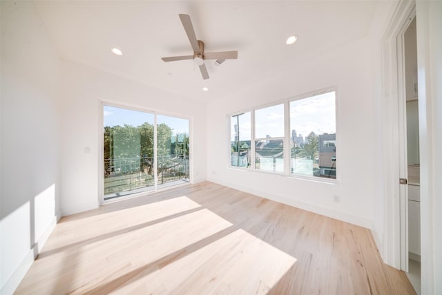 empty room featuring baseboards, recessed lighting, and light wood-style flooring