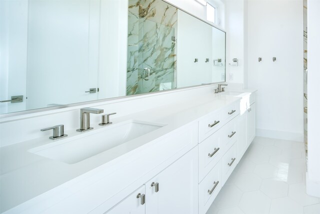 bathroom with vanity, walk in shower, and tile patterned flooring