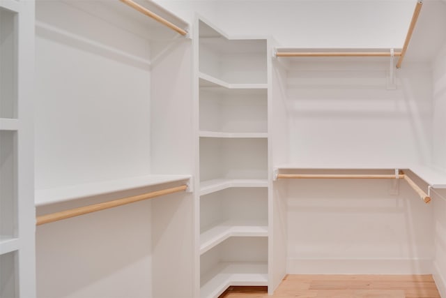 spacious closet with wood finished floors