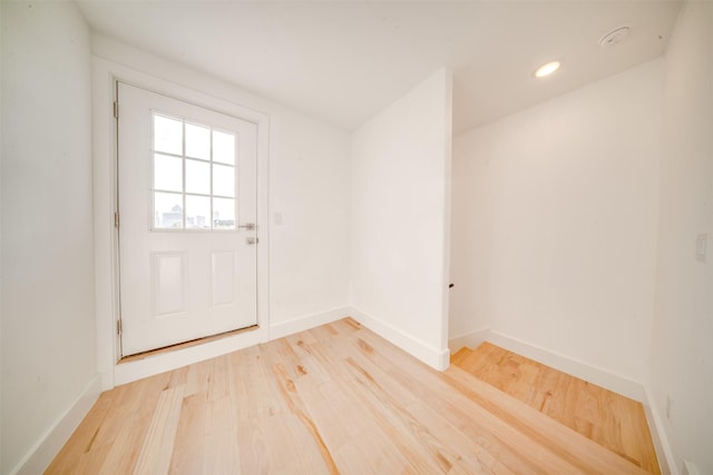 entryway featuring recessed lighting, baseboards, and light wood finished floors