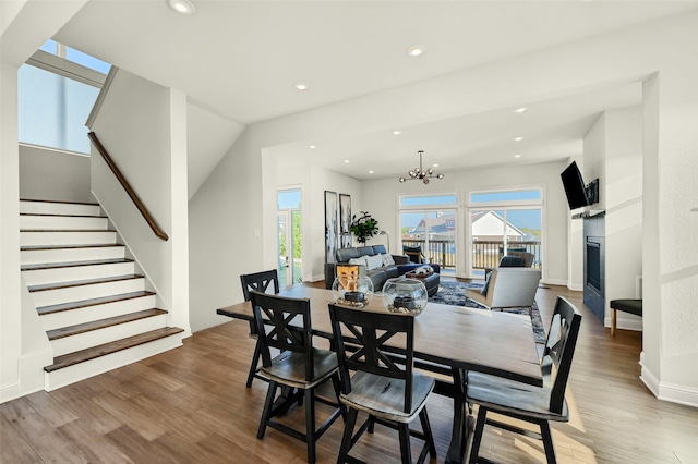 dining room featuring an inviting chandelier and hardwood / wood-style floors