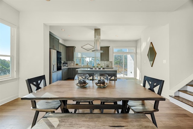 dining area with light wood-type flooring