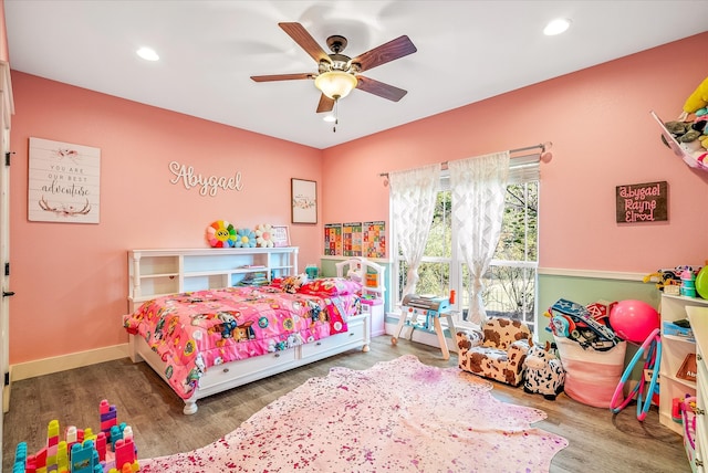 bedroom with hardwood / wood-style floors and ceiling fan