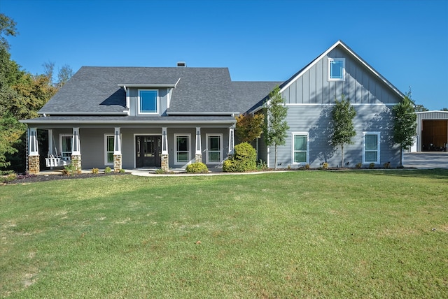 view of front of property featuring a front lawn and covered porch