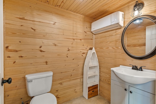 bathroom featuring an AC wall unit, vanity, wood walls, wood ceiling, and toilet