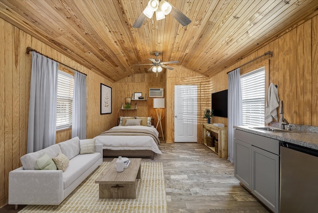 bedroom featuring wood walls, sink, lofted ceiling, wooden ceiling, and light hardwood / wood-style flooring