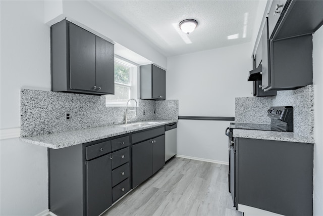 kitchen with tasteful backsplash, appliances with stainless steel finishes, a textured ceiling, light hardwood / wood-style flooring, and ventilation hood