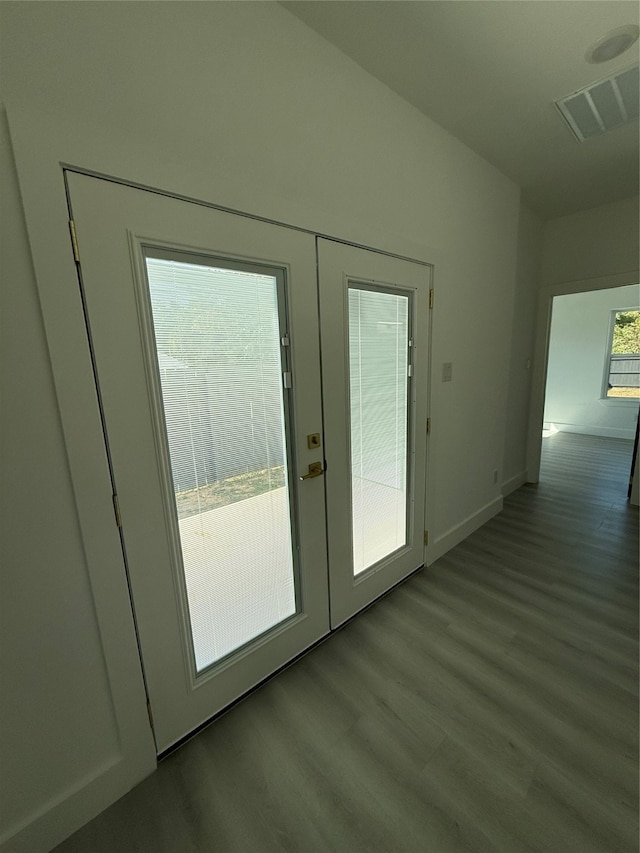 doorway featuring french doors and light wood-type flooring