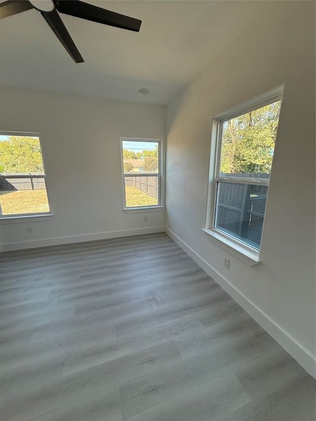 unfurnished room with light hardwood / wood-style floors and ceiling fan