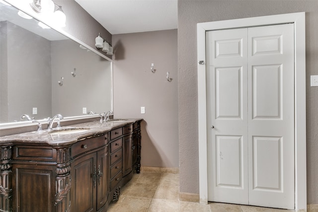 bathroom with tile patterned floors and vanity