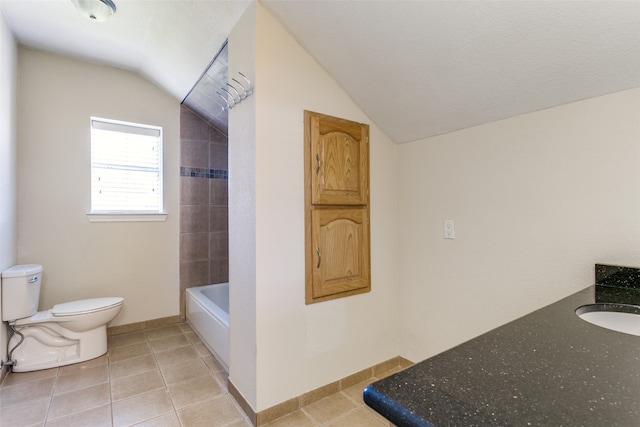 full bathroom featuring sink, tile patterned floors, toilet, and vaulted ceiling