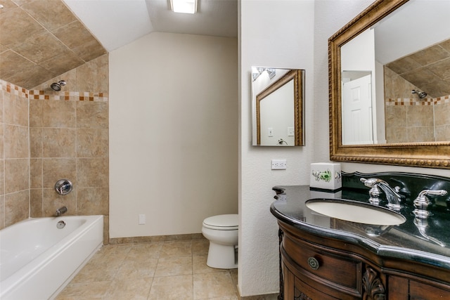 full bathroom with toilet, tiled shower / bath, tile patterned flooring, lofted ceiling, and vanity