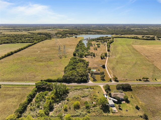 birds eye view of property with a water view and a rural view