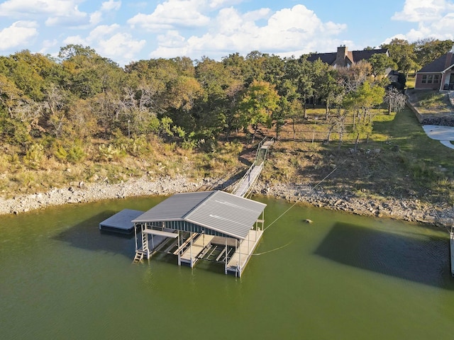 dock area with a water view and boat lift