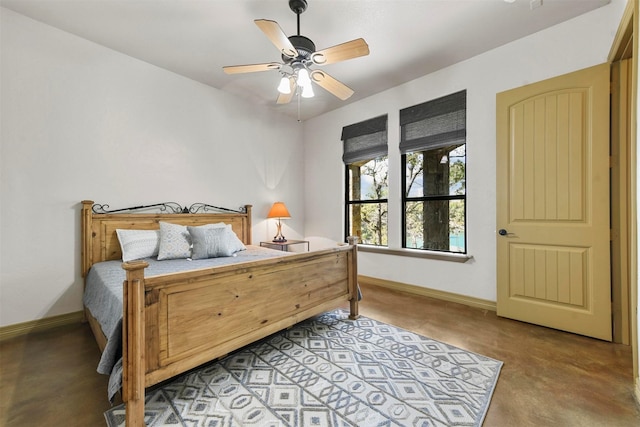 bedroom with baseboards and a ceiling fan