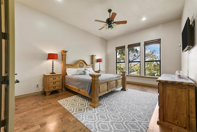 bedroom featuring baseboards, recessed lighting, a ceiling fan, and wood finished floors