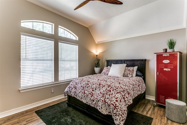 bedroom with ceiling fan, dark hardwood / wood-style floors, lofted ceiling, and multiple windows