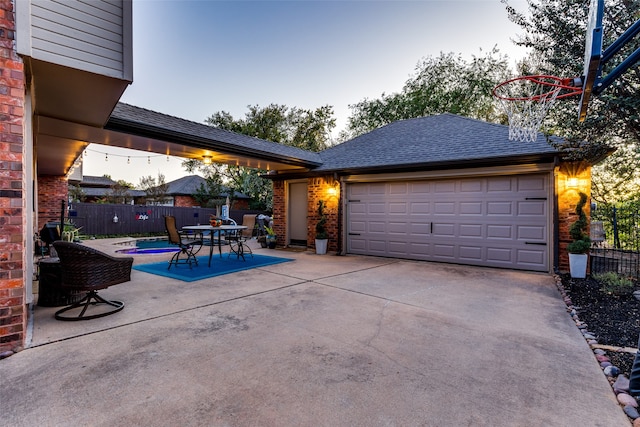 exterior space featuring a fenced in pool and a garage