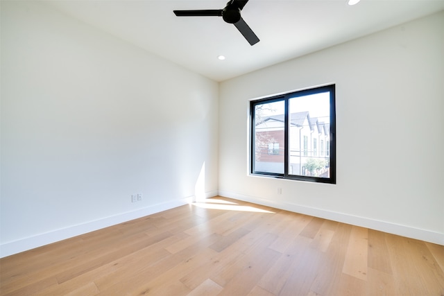 spare room featuring light wood-type flooring and ceiling fan