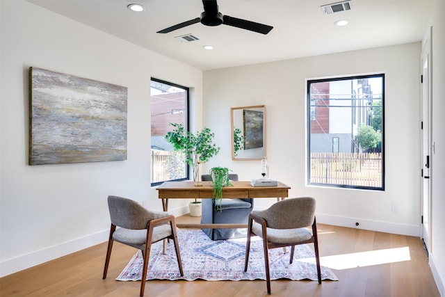 office space with ceiling fan, hardwood / wood-style flooring, and a wealth of natural light