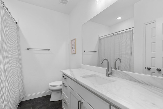 bathroom featuring toilet, visible vents, vanity, and baseboards