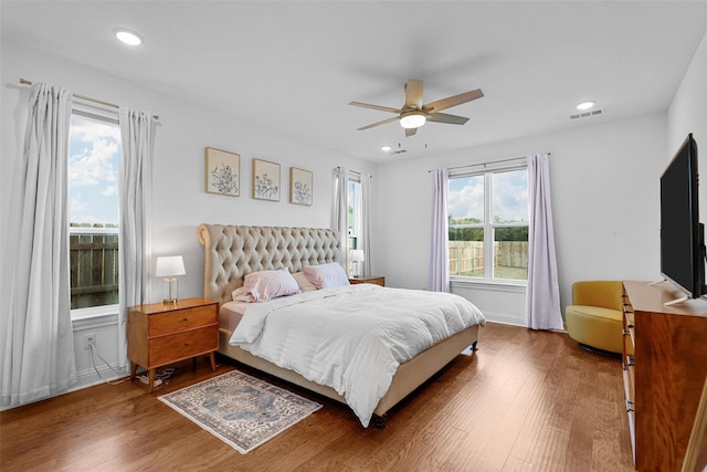 bedroom with visible vents, wood finished floors, ceiling fan, and recessed lighting