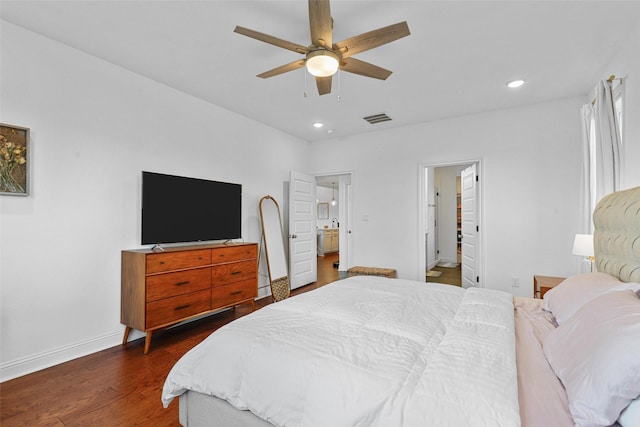 bedroom with baseboards, visible vents, dark wood-type flooring, and recessed lighting