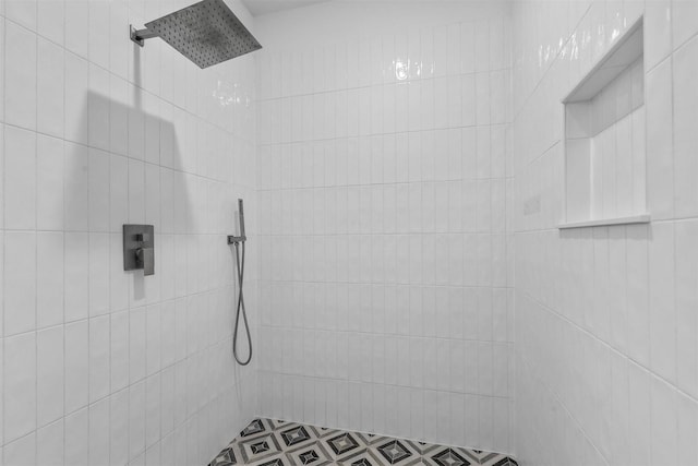 full bath featuring a tile shower