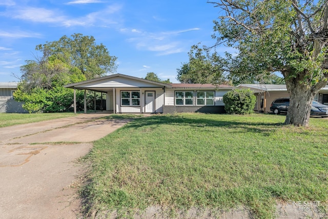 single story home with a carport and a front lawn