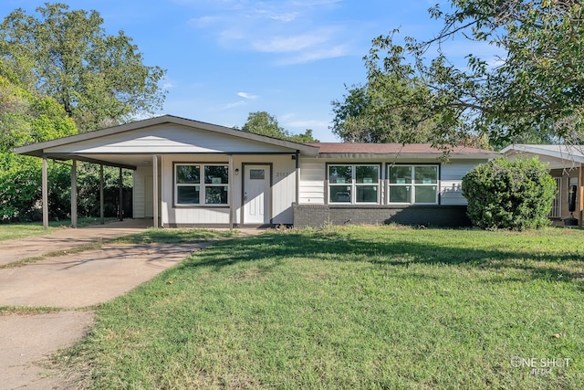 single story home with a front yard and a carport