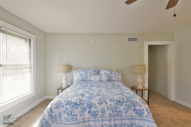 bedroom with ceiling fan and carpet