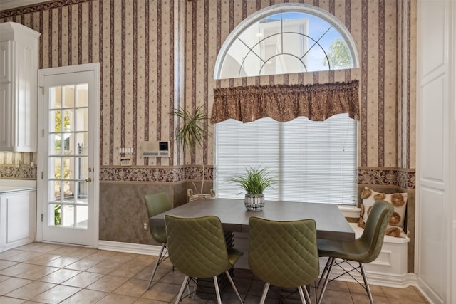 tiled dining area with a wealth of natural light