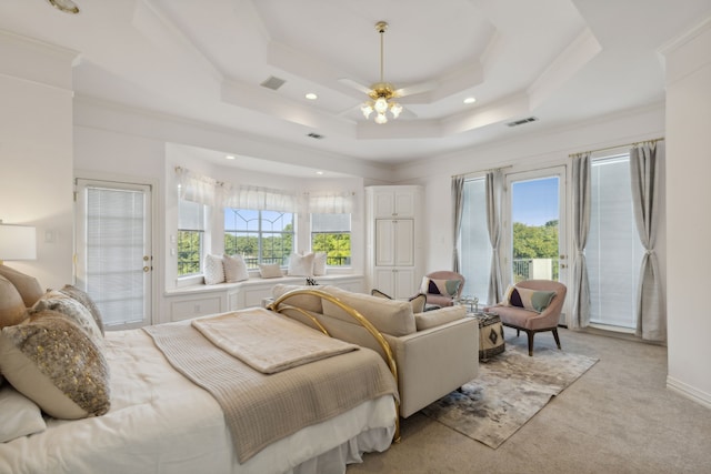 bedroom with ornamental molding, access to outside, light colored carpet, a raised ceiling, and ceiling fan