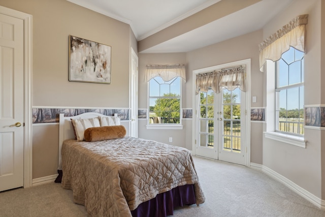 carpeted bedroom with access to exterior and ornamental molding