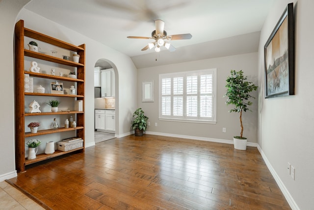 interior space featuring lofted ceiling, hardwood / wood-style floors, and ceiling fan