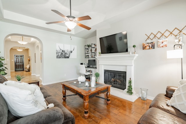 living room with hardwood / wood-style flooring and ceiling fan