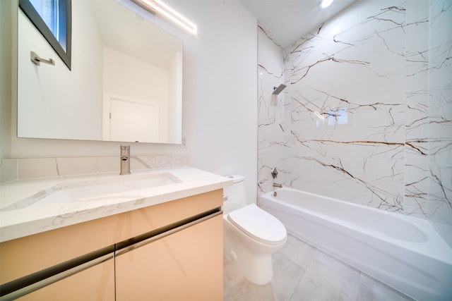 full bathroom featuring vanity, tiled shower / bath combo, and toilet