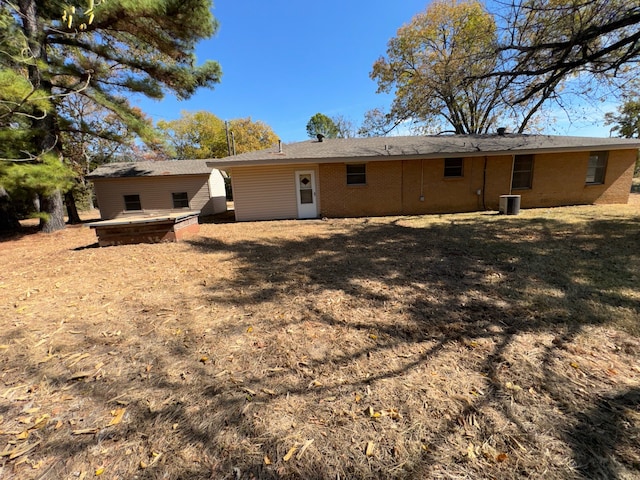 rear view of house with central AC