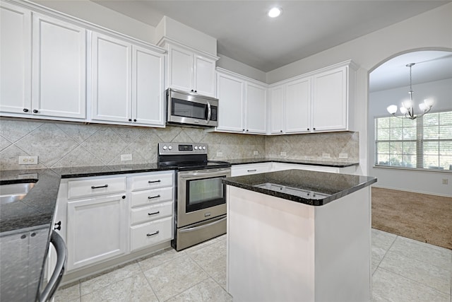 kitchen featuring appliances with stainless steel finishes and white cabinetry