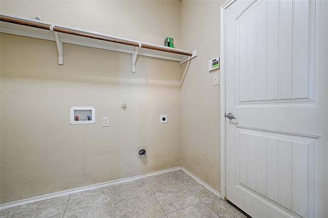 clothes washing area featuring hookup for an electric dryer, light tile patterned flooring, hookup for a washing machine, and gas dryer hookup