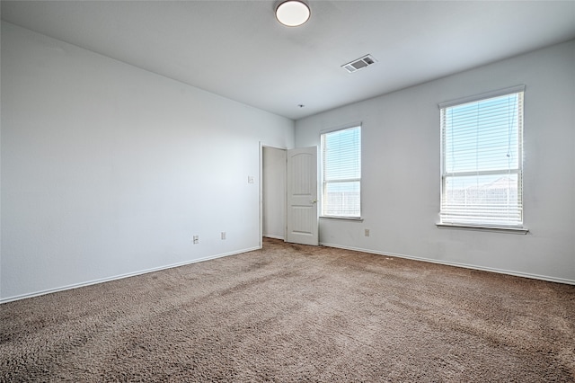 empty room featuring carpet flooring