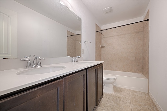 full bathroom with vanity, toilet, tile patterned flooring, and tiled shower / bath