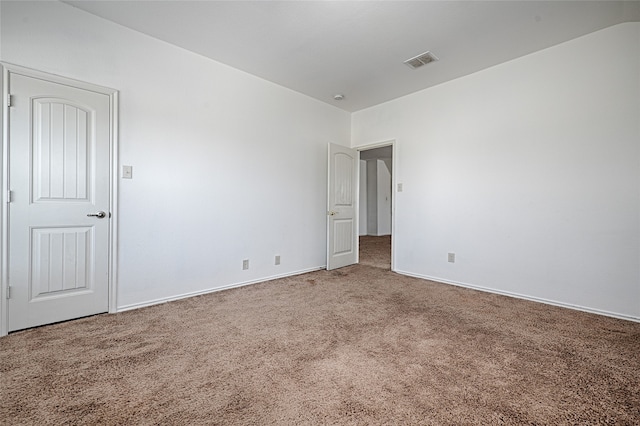 spare room featuring carpet flooring