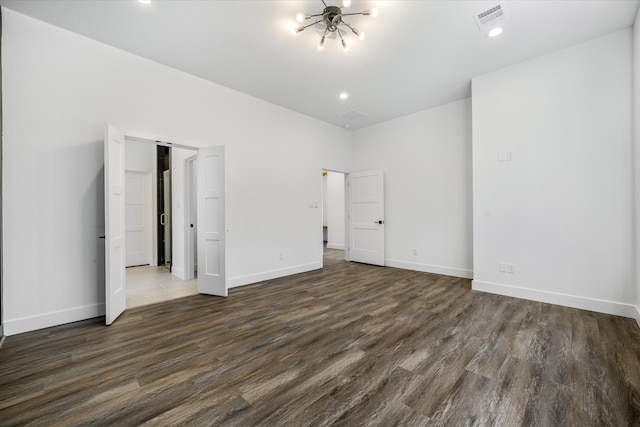 unfurnished bedroom with dark hardwood / wood-style floors