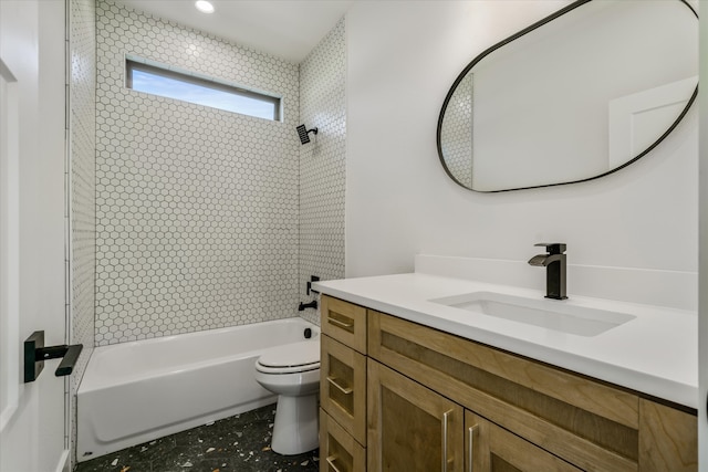 full bathroom with toilet, tiled shower / bath combo, and vanity