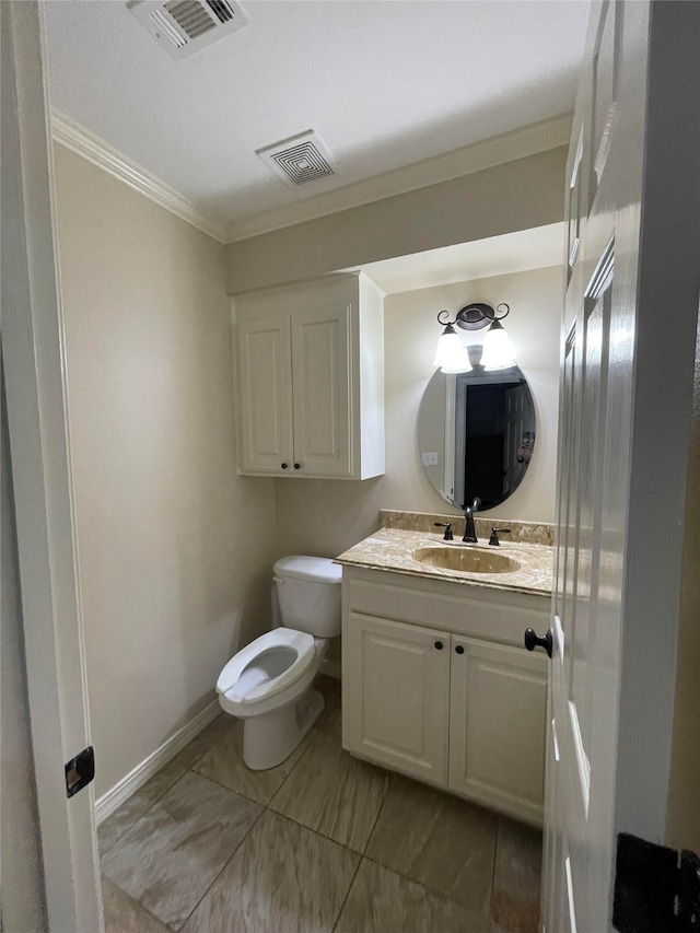 half bath featuring ornamental molding, visible vents, vanity, and toilet