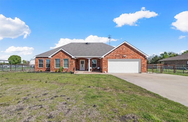 view of front of house featuring a front lawn and a garage